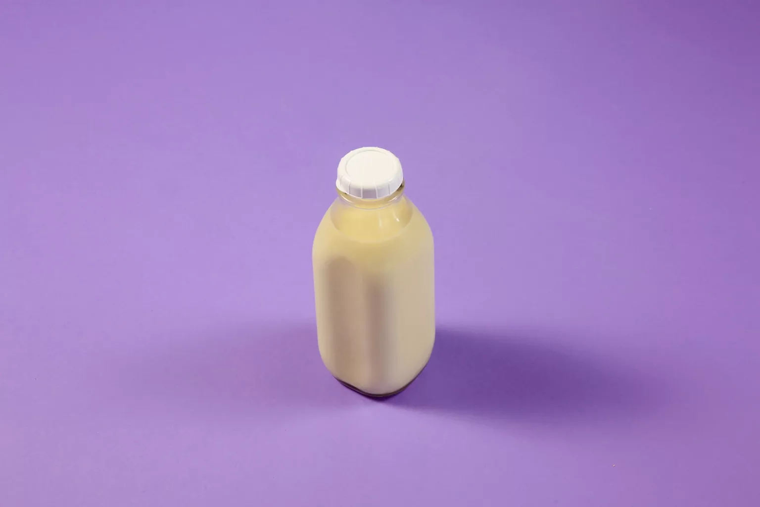 Replacing single-use plastic requires systemic change Milk fills a reusable glass bottle