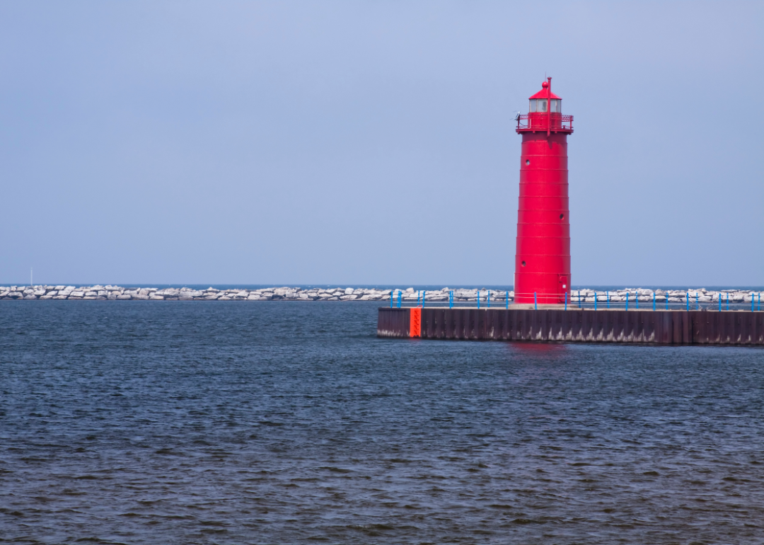 The bright red Muskegon Pier Lighthouse. 