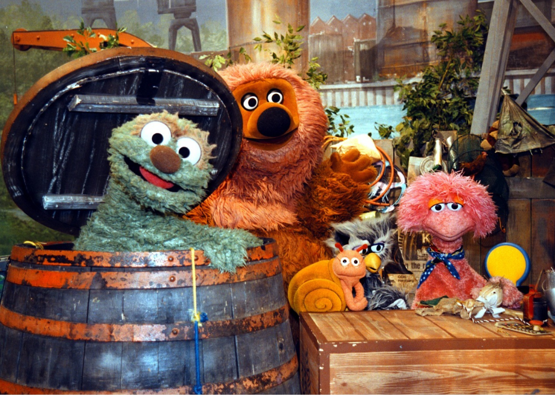 Several puppet characters on the set of Sesame Street.