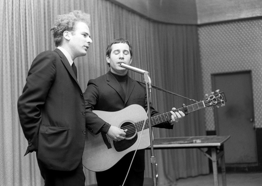 Simon And Garfunkel appear for a performance on the campus of Washington University.