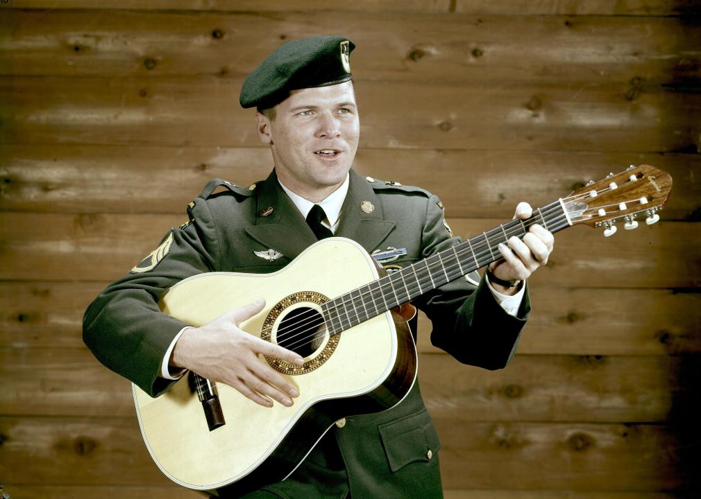 Photo of Sgt. Barry Sadler with guitar.
