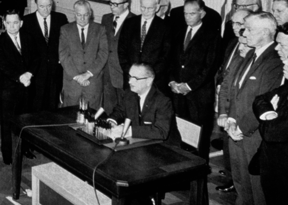 President Johnson signing Gulf of Tonkin Resolution. 