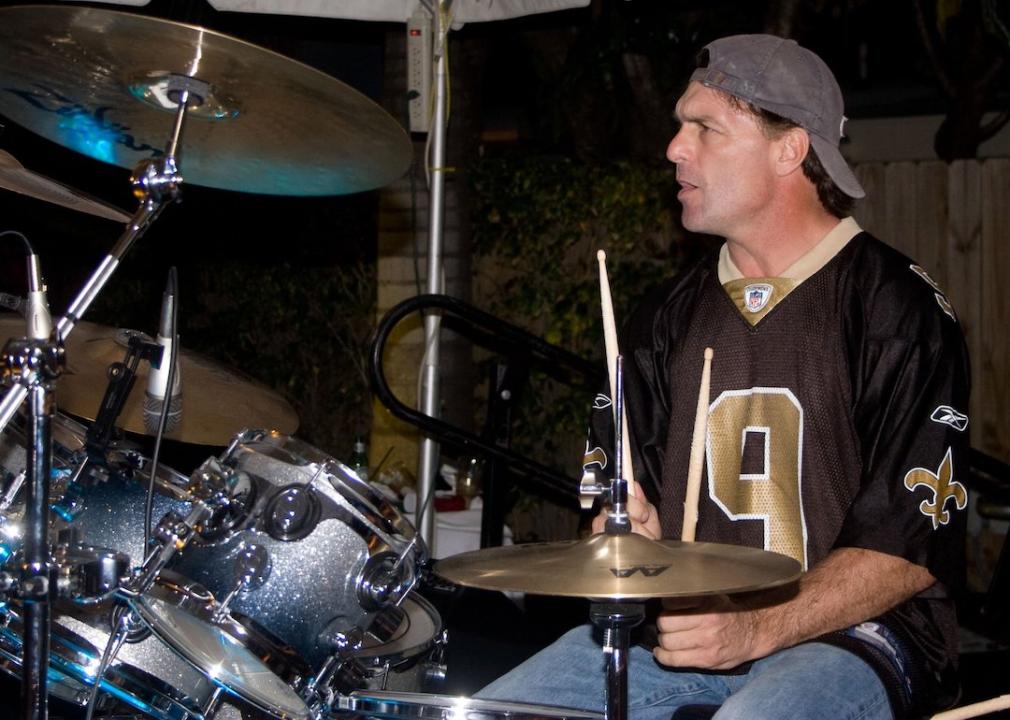 Former NFL quarterback Doug Flutie plays the drums with the Flutie Brothers Band at the 2010 Gridiron Greats Billfish Bowl on Feb. 4, 2010 in Key Largo, Florida.
