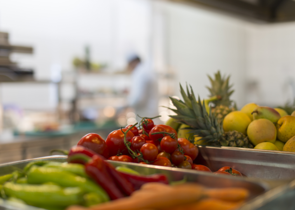 Fruits and vegetables in a restaurant kitchen.