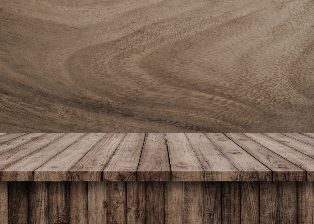 A wooden bench with wood background