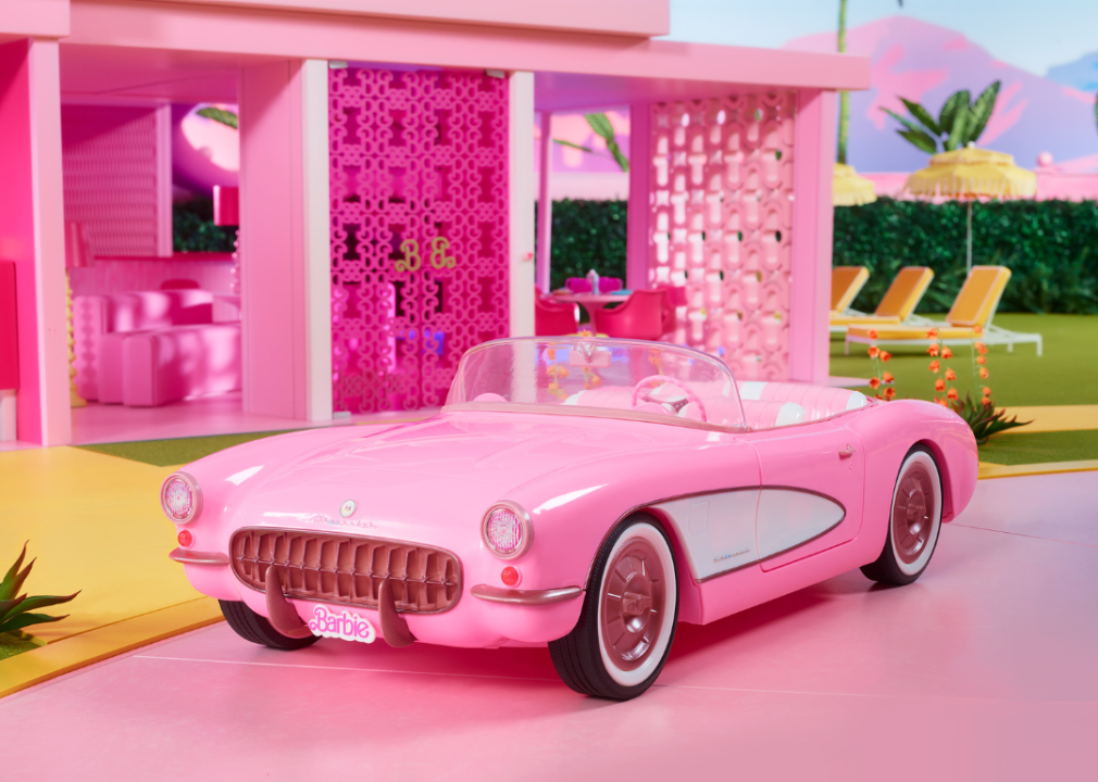 Barbie's pink Corvette in front of the Dreamhouse
