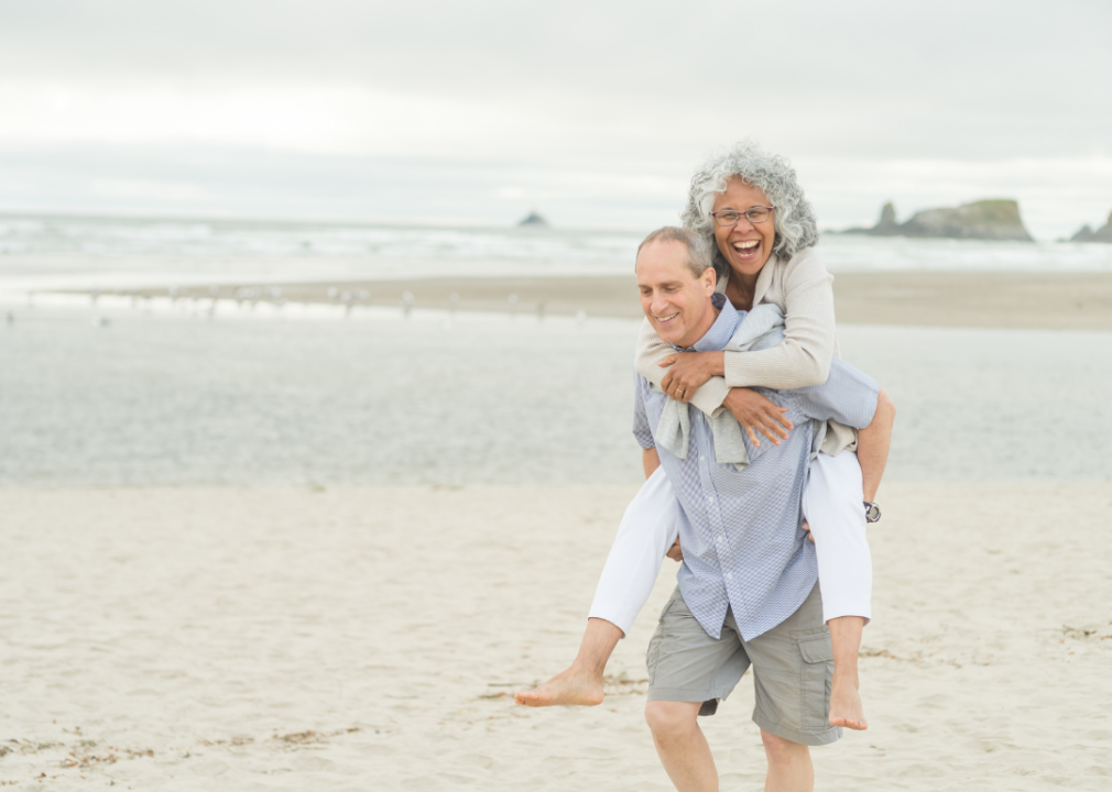 An older couple walking on the beach