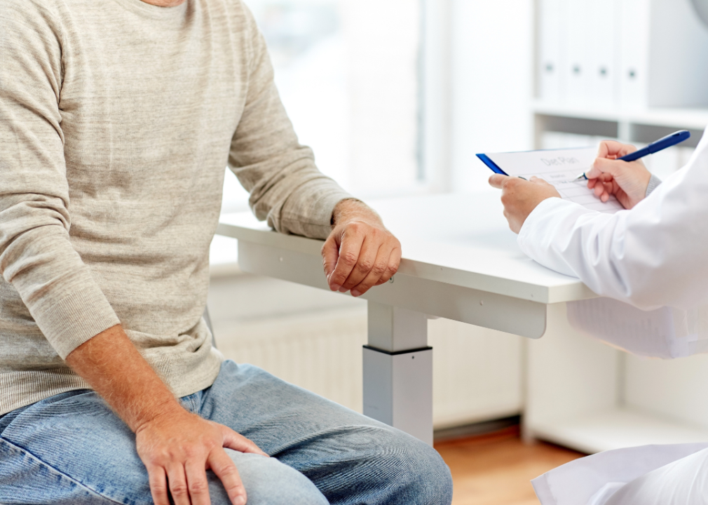 An older man consulting with a doctor