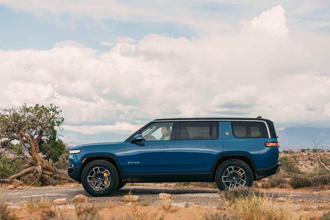 blue Rivian R1S in the desert