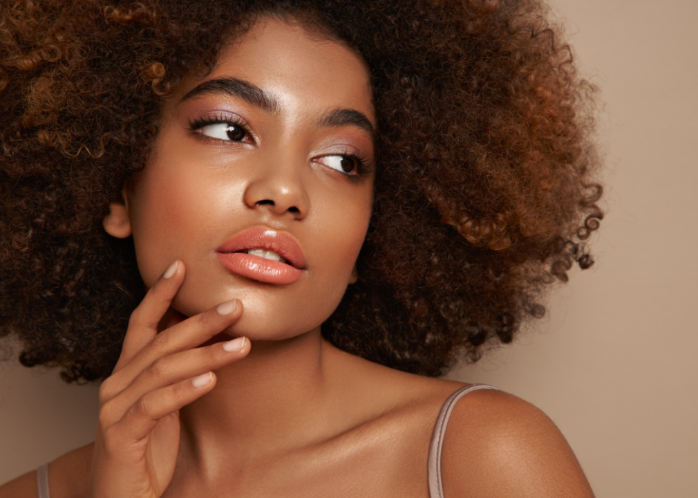 Black woman flaunting stunning makeup.