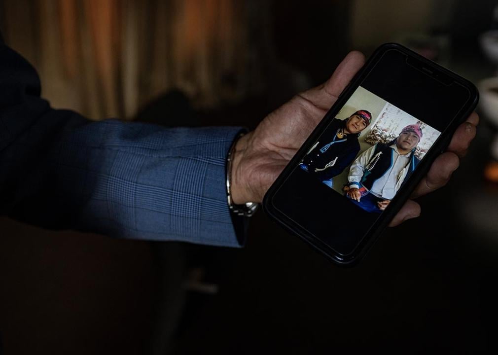 Lee Yaiva shows a photo on his phone of his late brothers, who died from liver disease related to alcoholism