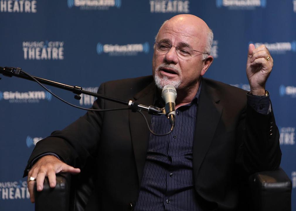 Dave Ramsey in front of mic and a blue background with SiriusXM radio logo 