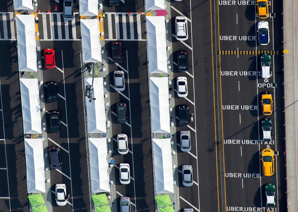 aerial view of line of ubers waiting to enter rideshare lot