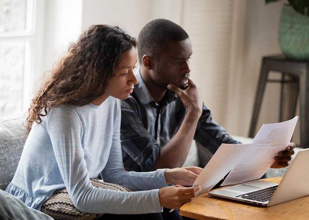 couple looks over finances at home