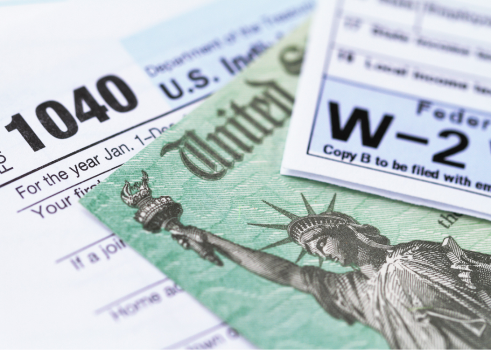1040 and W-2 tax forms, with U.S. treasury check