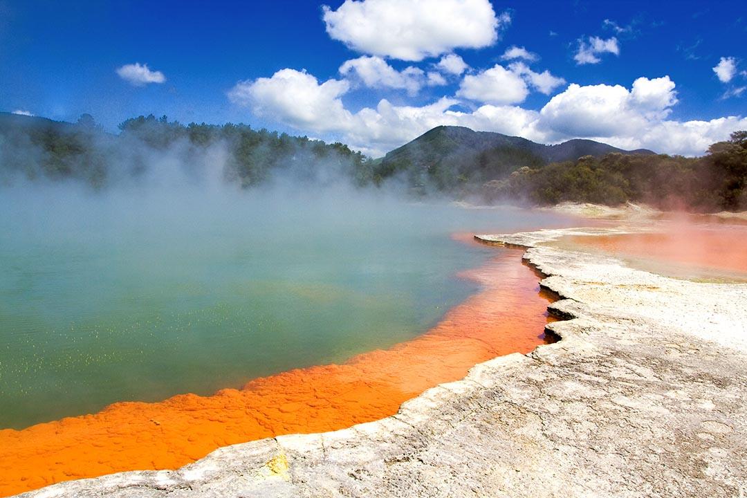 orange and green Champagne Pool in Wai-O-Tapu Geothermal Wonderland, Rotorua, New Zealand
