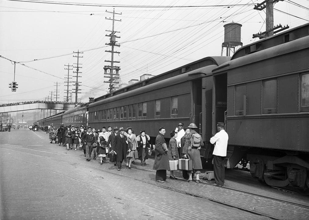 Mass evacuation of Japanese Americans from Bainbridge Island, Seattle, Washington, 30th March 1942 boarding trains under wartime presidential Executive Order 9066.