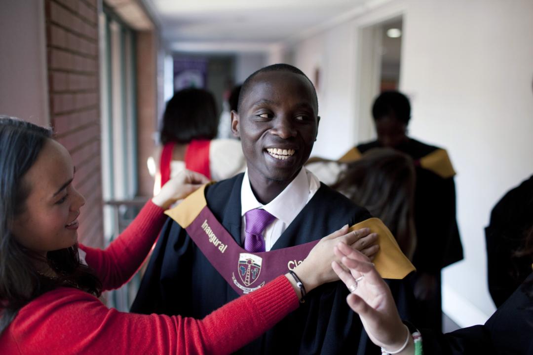 Joseph Munyambanza, a student from the Democratic Republic of Congo gets dressed before the African Leadership Academy (ALA) graduation day ceremony in the school in Honeydew, west of Johannesburg, South Africa.