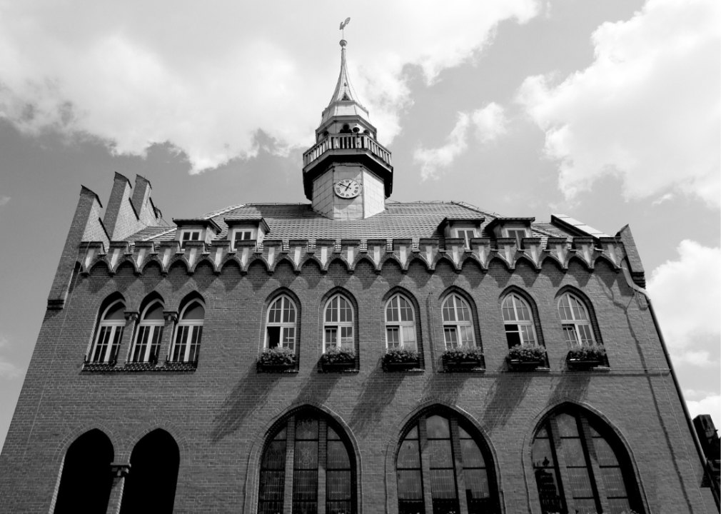 An upward view of a stately brick school. 