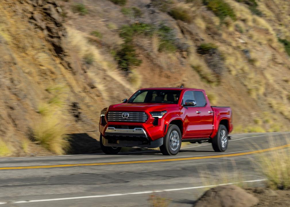 A red 2022 Toyota Tacoma being driven on the road.