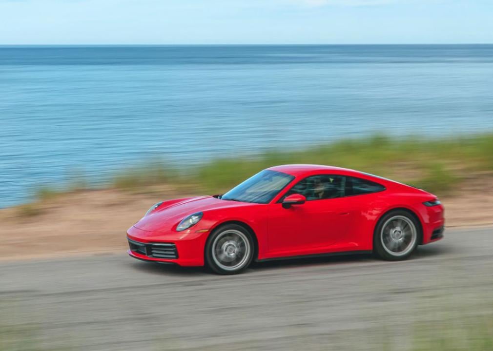 A red Porsche 911 on the road.