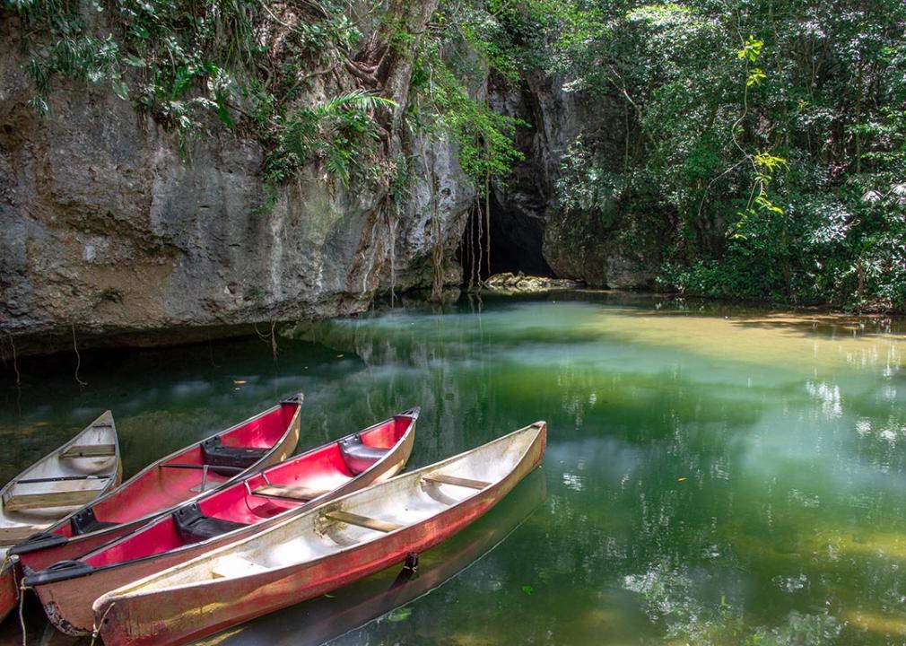 Canoes at the entrance to Barton Creek Cave in the Cayo District of Belize, Central America. 
