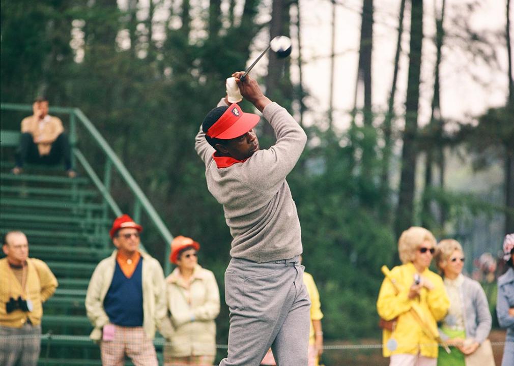 Lee Elder tees off during the 1975 Masters Tournament at Augusta National Golf Club in April 1975 in Augusta, Georgia.