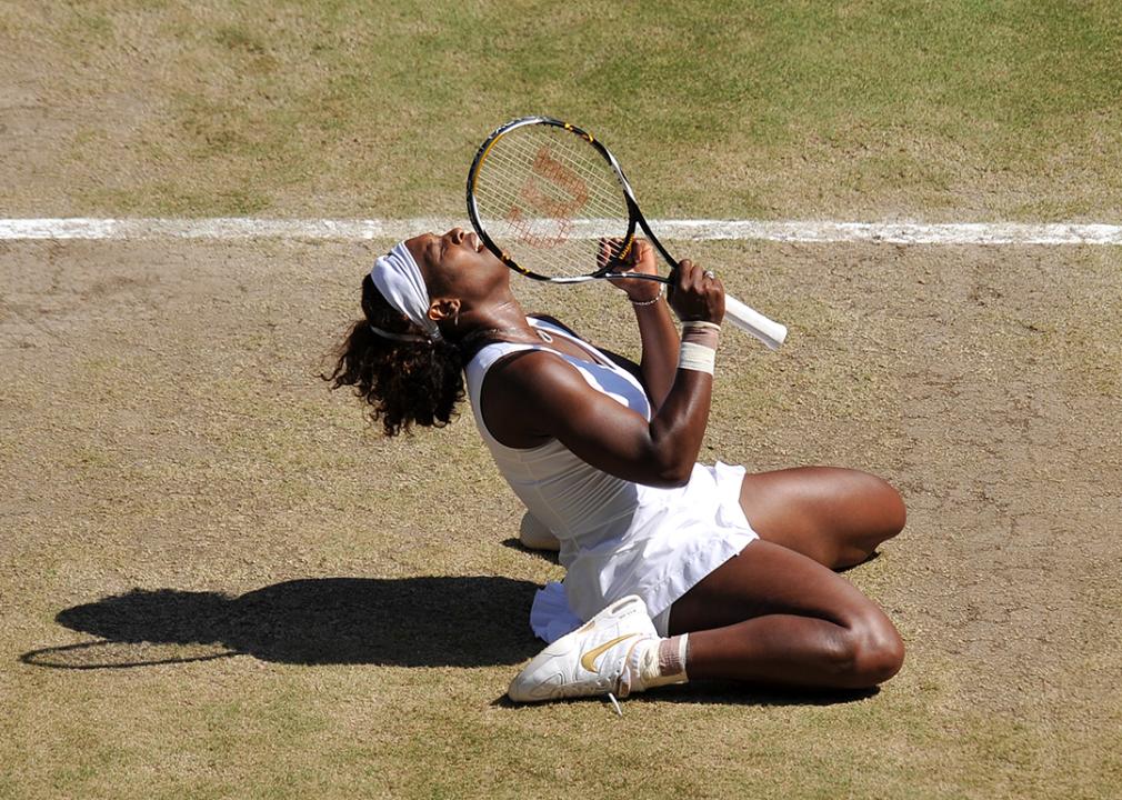 Serena Williams celebrates after beating her sister Venus 7-6, 6-2, during their Women's Singles Final of the 2009 Wimbledon Tennis Championships at the All England Tennis Club, in southwest London, on July 4, 2009. 