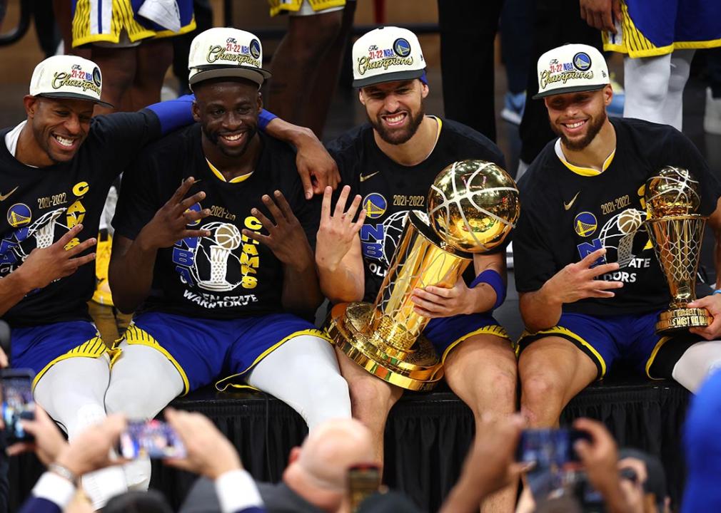 Andre Iguodala #9, Draymond Green #23, Klay Thompson #11 and Stephen Curry #30 of the Golden State Warriors pose for a photo after defeating the Boston Celtics 103-90 in Game Six of the 2022 NBA Finals at TD Garden on June 16, 2022 in Boston, Massachusetts.