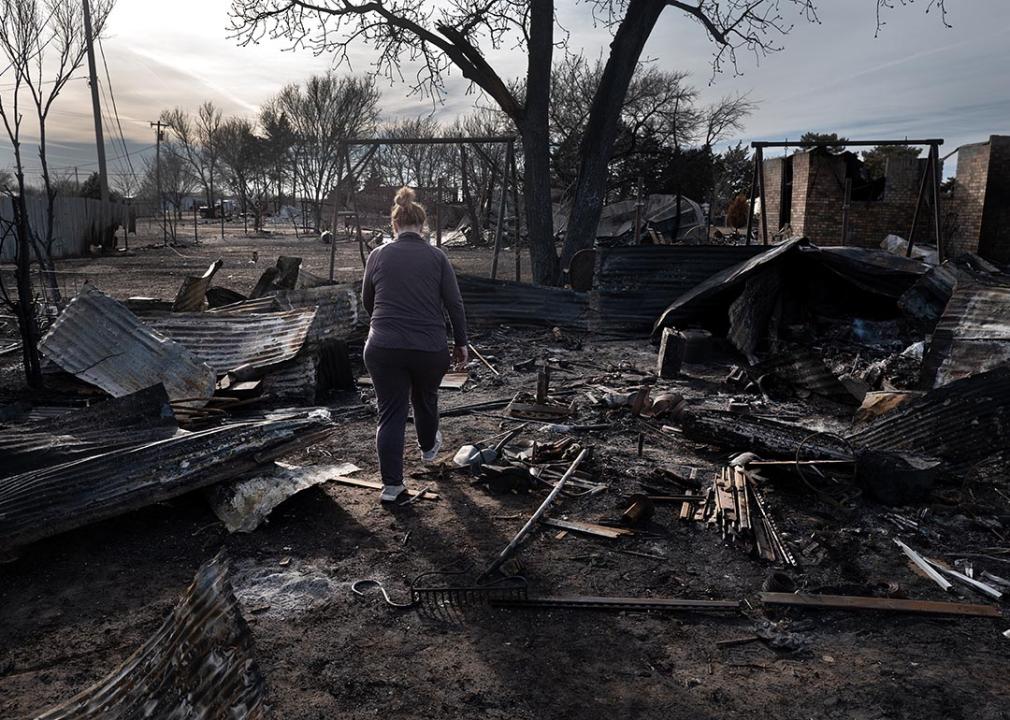 Angie Hodges searches for items in the remains of her home after it was destroyed by the Smokehouse Creek fire, which burned more than a million acres, on March 03, 2024 near Stinnett, Texas.