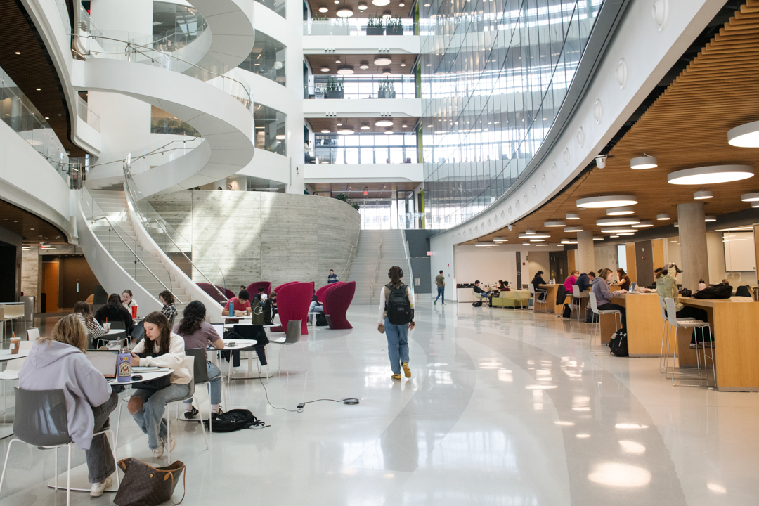 Student life inside the atrium of the Interdisciplinary Science and Engineering Complex, or ISEC, on the campus of Northeastern University.