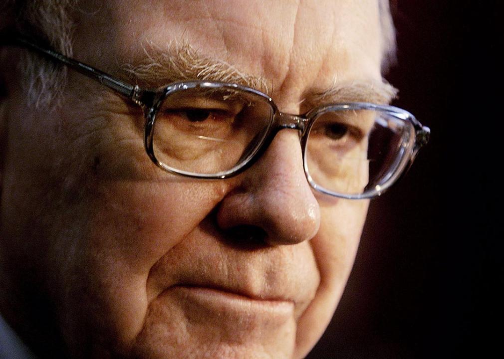 Close up photo of Warren Buffett of Berkshire Hathaway talking to members of the press at shareholders meeting.