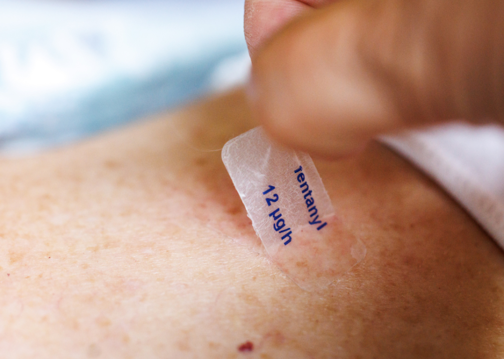 Lollipops and patches hit the market A woman removes a used fentanyl patch labeled "fentanyl 12 micrograms per hour."