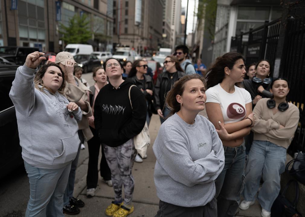 Fans gathered outside who scanned the QR code and celebrated to Taylor Swift's music at the worksite. 