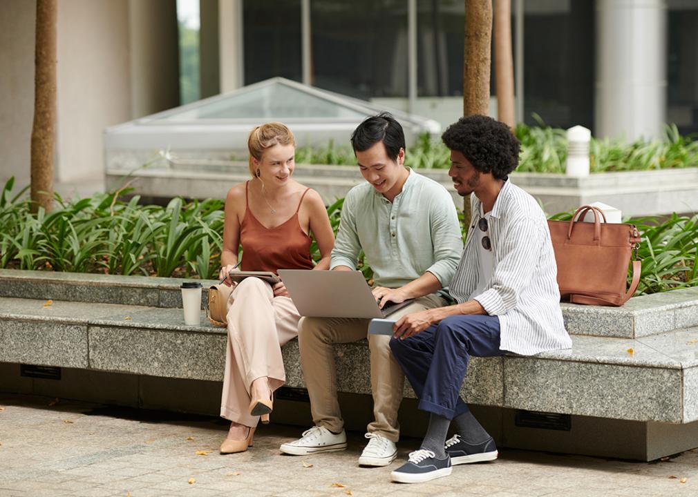 Diverse group of young adults having a financial discussion.