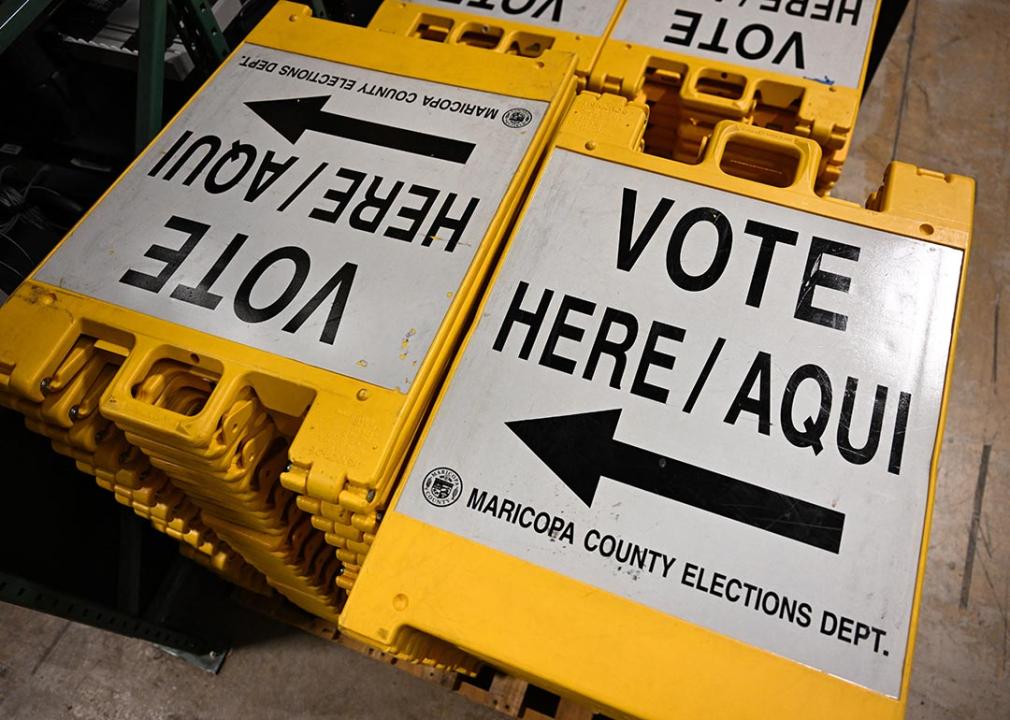 Yellow and white "Vote here" signage stored at a warehouse at the Maricopa County Tabulation and Election Center (MCTEC) ahead of the 2024 Arizona Primary. 