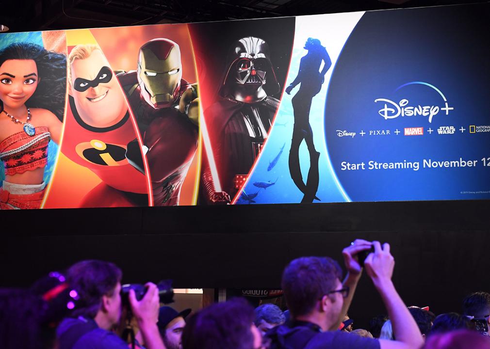 Attendees visit the Disney+ streaming service booth at the D23 Expo in 2019 at the Anaheim Convention Center in Anaheim, California.