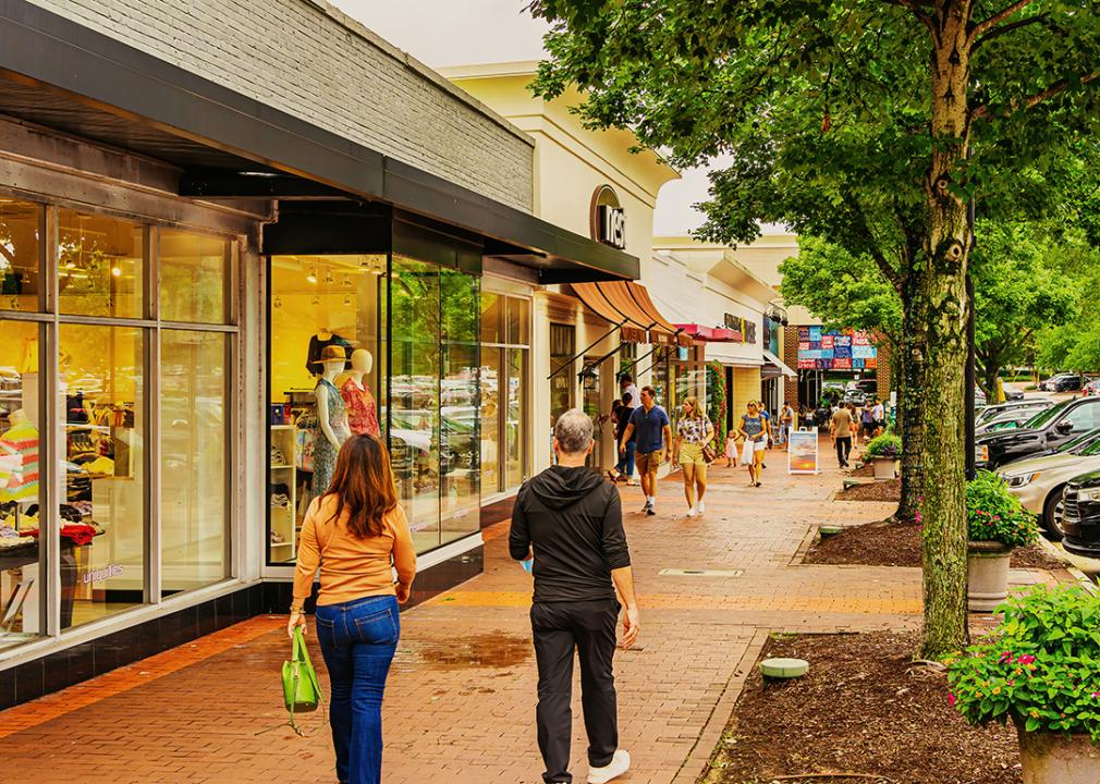 Shoppers walking in a village district in North Carolina.