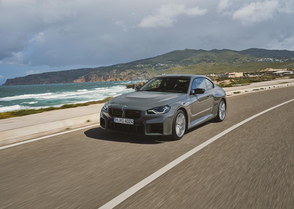 A gray 2025 BMW M2 on the road.