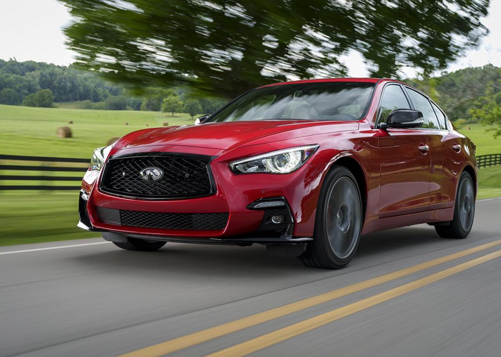 A red Infiniti Q50 on the road.