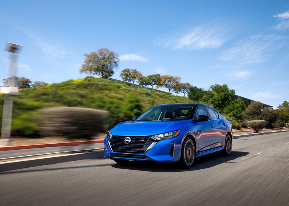 A blue 2025 Nissan Sentra on the road.