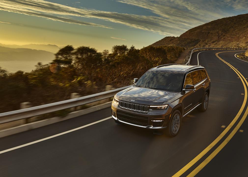 A 2025 black Jeep Grand Cherokee L on the road.