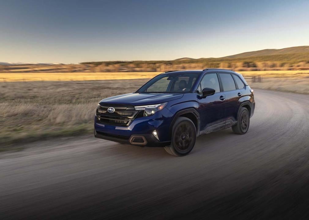 A blue 2025 Subaru Forester on a road.