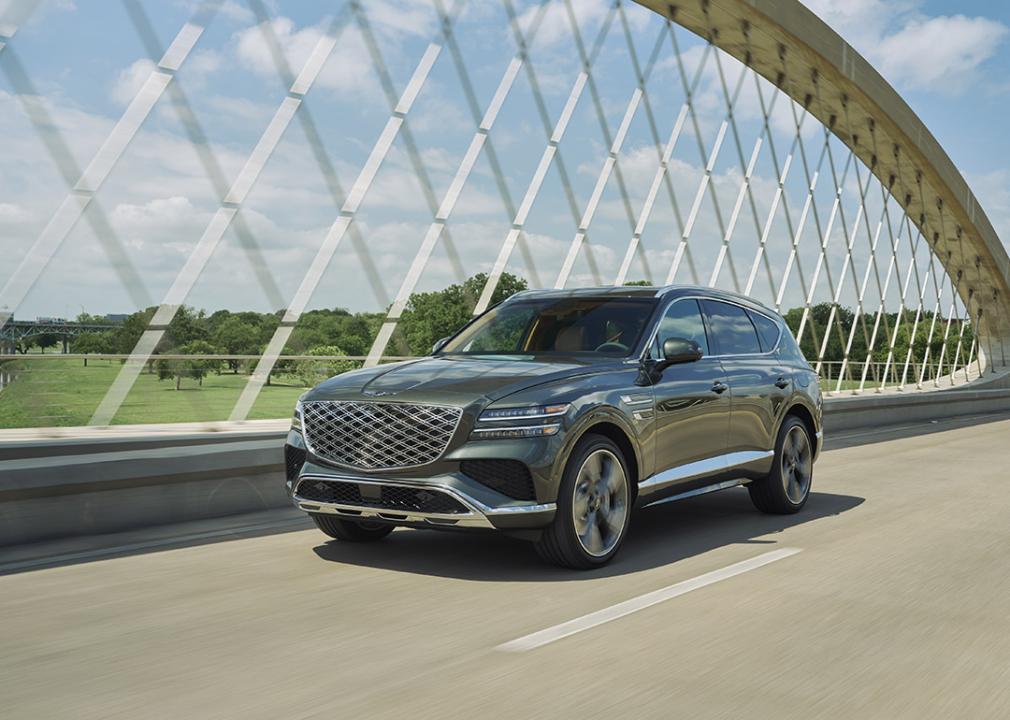 A black 2025 Genesis GV80 on the road.