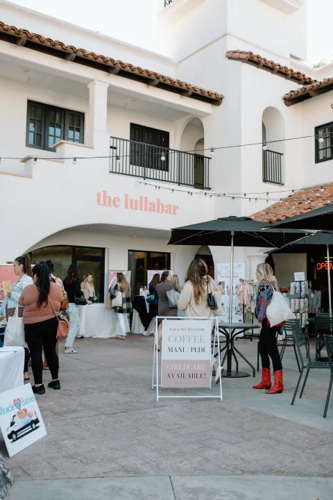 Exterior of The Lullabar with many customers walking in.