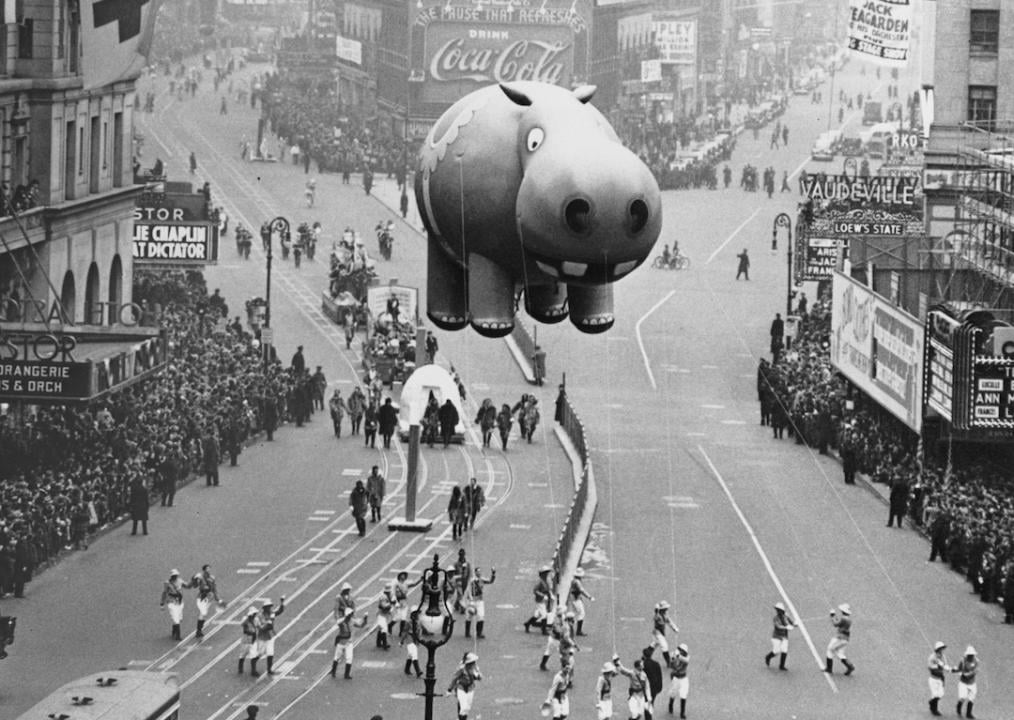 A hippo balloon floats over Times Square during the annual Macy's Thanksgiving Day Parade in New York City in 1940.