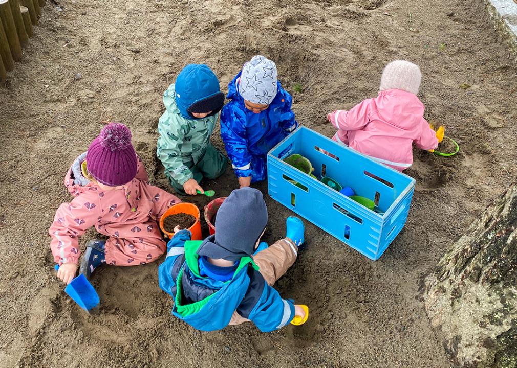 Children play outside at a child care program run by the Norwegian nonprofit Kanvas.