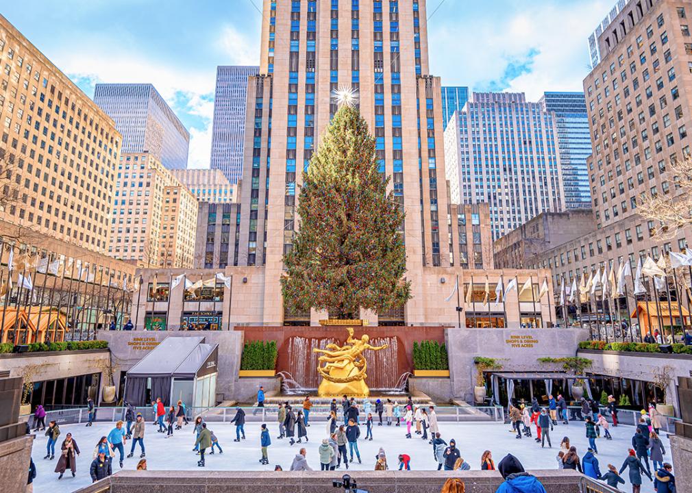 Ice skaters in front of the Christmas tree at the Rockefeller center. 