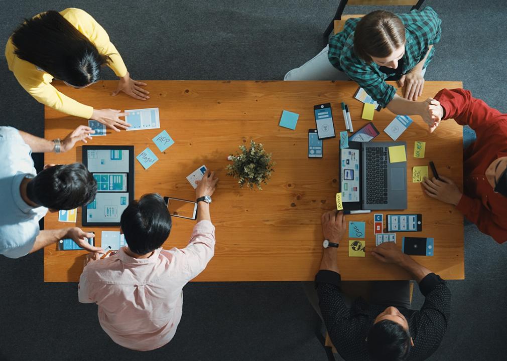 A group of IT staff and programmer brainstorming on new UI/UX projects.