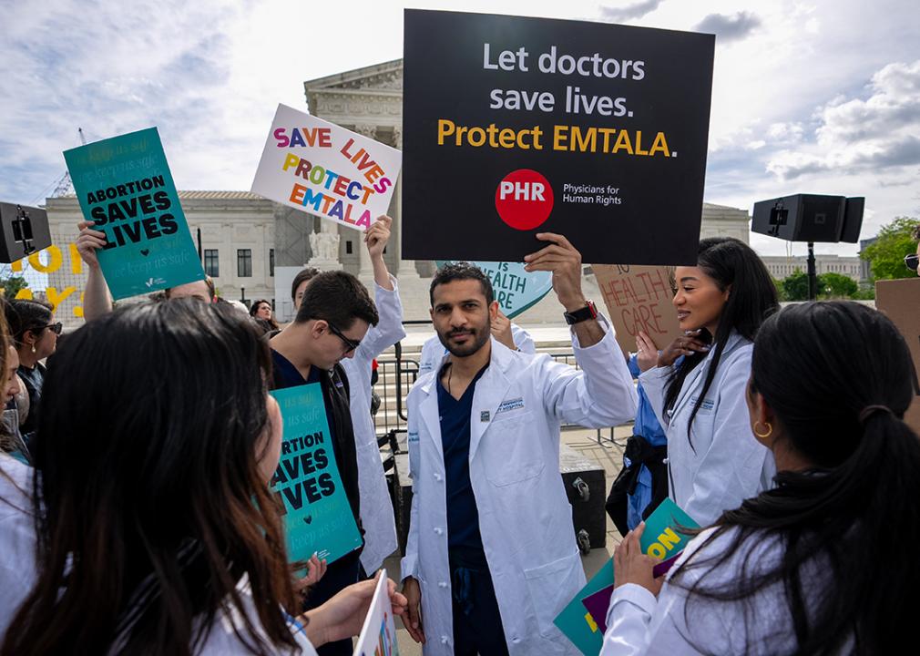 Doctors join abortion rights supporters at a rally outside the Supreme Court on April 24, 2024 in Washington, DC.